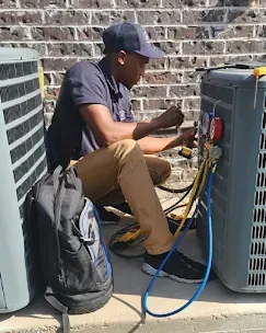Common AC Problems: Troubleshooting Guide 3 Technician detecting refrigerant leaks in an air conditioning system, showcasing professional tools and expertise